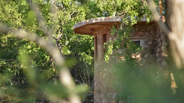 Camouflaged Stone Blind & Subterranean Photo Hide